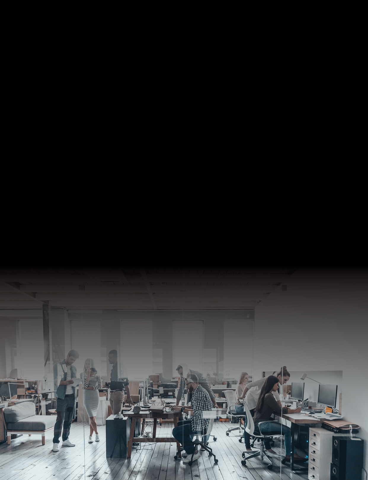 Group of young business people in smart casual wear working together in creative office